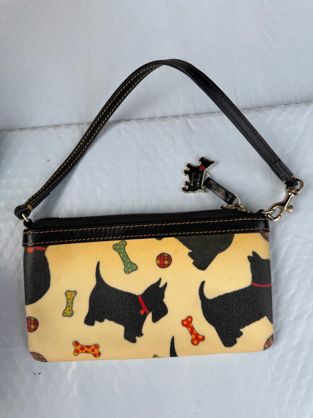 Dooney & Bourke Black Scottie Dog Print Wristlet with Cream Background